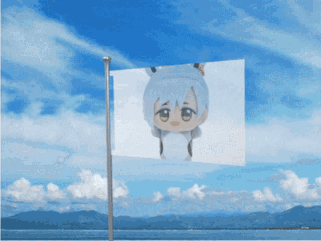 a flag with a picture of a girl on it flying in the wind