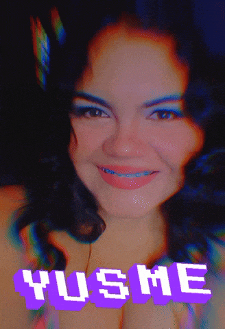 a woman with braces on her teeth is smiling in front of a purple sign that says yusme