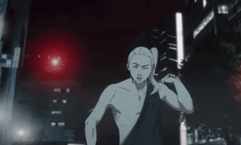 a naked man in a black robe is running down a city street at night .