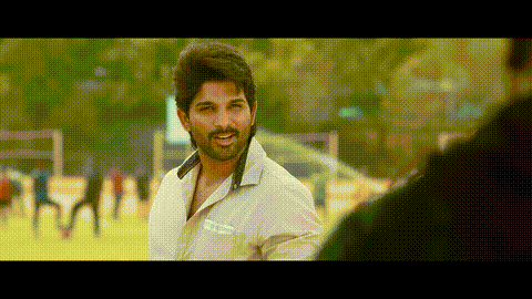 a man with a beard and a white shirt is standing in a field .