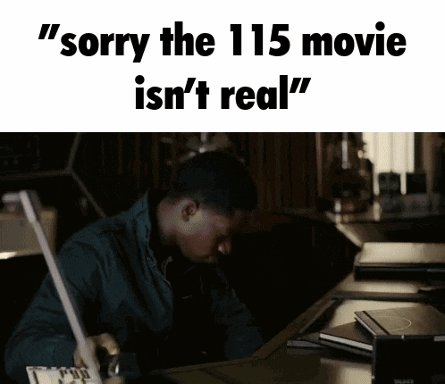 a man sitting at a desk with the words " sorry the 115 movie is n't real "