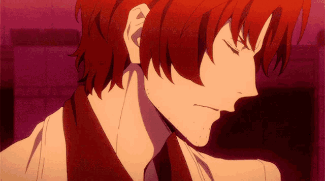 a close up of a man with red hair and a beard