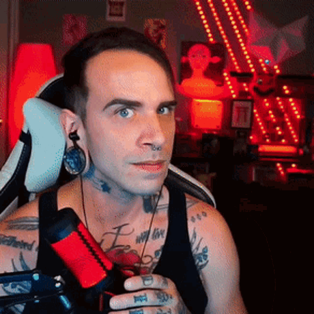 a man with a tattoo on his arm that says " i love "