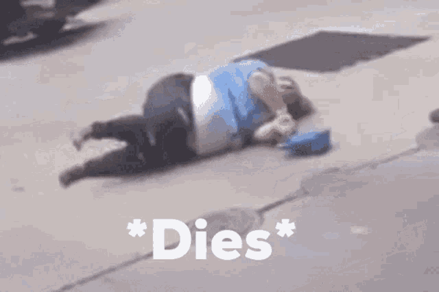 a person is squatting down on the sidewalk and the word dies is on the bottom of the image