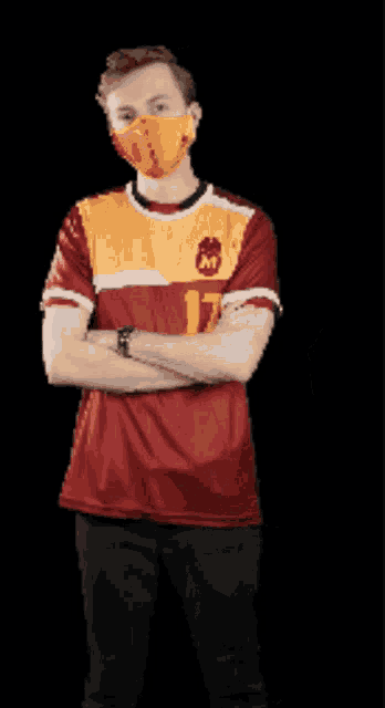 a man wearing a mask and a jersey with the number 17