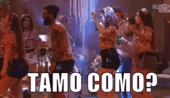 a group of people dancing with the words tamo como written in white