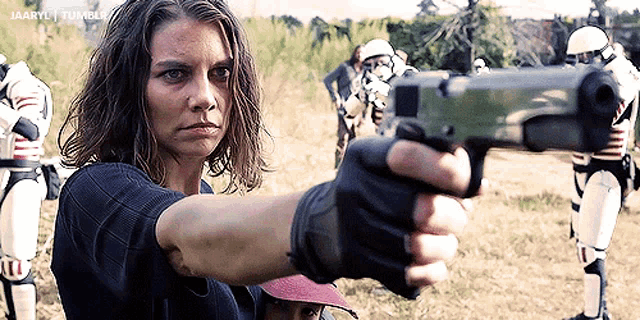 a woman is holding a gun in front of a group of soldiers and says jaaryl tumblr on the bottom right