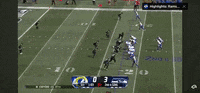 a football game is being played between the rams and the giants