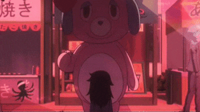 a pink teddy bear mascot is standing next to a girl in a pink outfit .