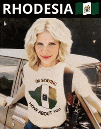 a woman wearing a rhodesia t-shirt stands next to a car