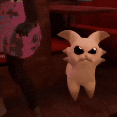 a close up of a stuffed animal with horns making a face .