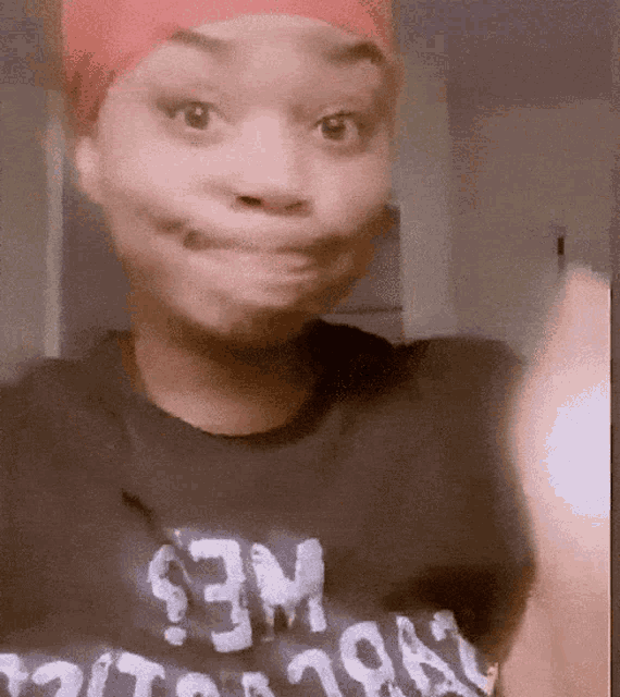a woman wearing a black t-shirt that says wes