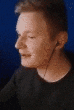 a blurry picture of a man with headphones on