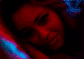 a close up of a woman 's face in a pixel art style