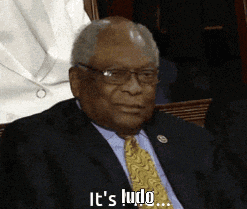 a man in a suit and tie is saying " it 's ludo "