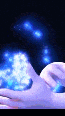 a hand is holding a glowing object in the dark