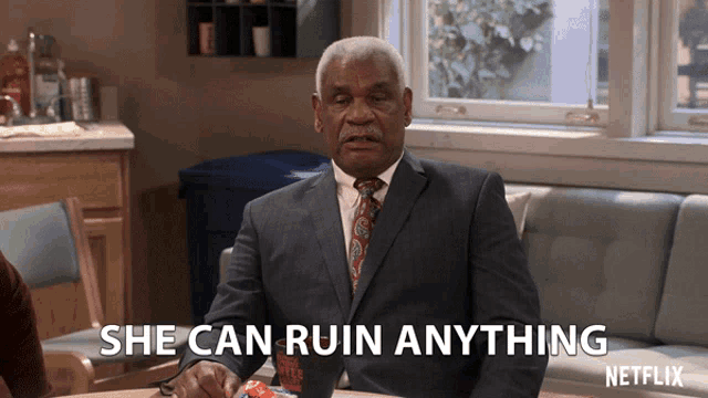 a man in a suit and tie says she can ruin anything on a netflix ad