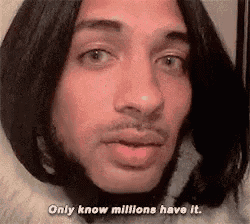 a man with long hair and a beard is wearing a fur coat and says `` only know millions have it '' .