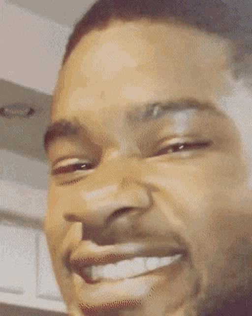 a man with his eyes closed is making a funny face