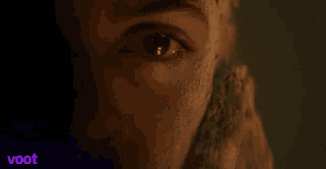 a close up of a person 's eye with the word voot in the background