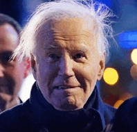 a close up of a man 's face with a blurred background .