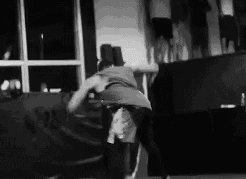 a man is doing a trick in a black and white photo .