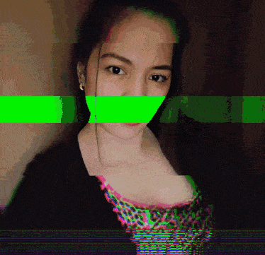 a woman with a green stripe covering her mouth