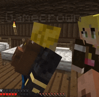 a couple of minecraft characters standing next to each other with a bed in the background