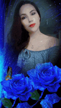 a woman is surrounded by blue roses with a butterfly in the background