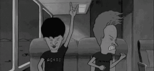 a black and white cartoon of beavis and butthead sitting in a bus .
