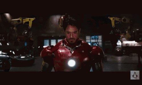 a close up of a man in a red and gold iron man costume