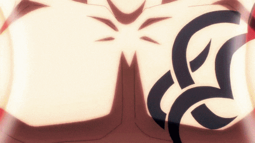 a close up of a person 's chest with a black tattoo