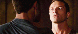 two men are looking at each other and one says oh that 's a new look for you