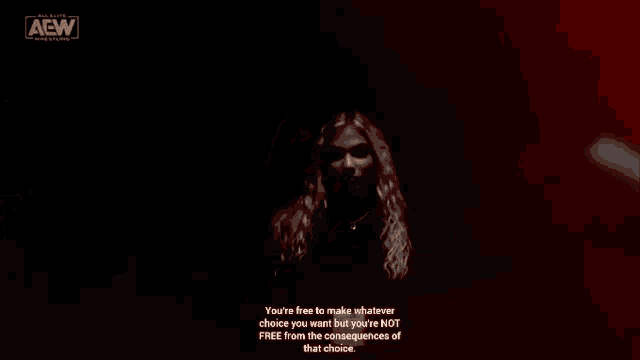 a woman with long blonde hair is standing in front of a red background with a quote on it .