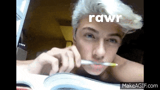 a shirtless man with a pencil in his mouth and the word rawr written above him