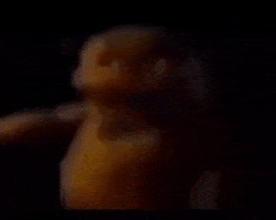 a close up of a person 's face in a dark room .