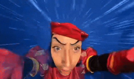 a cartoon character wearing a red hat and gloves is taking a selfie .