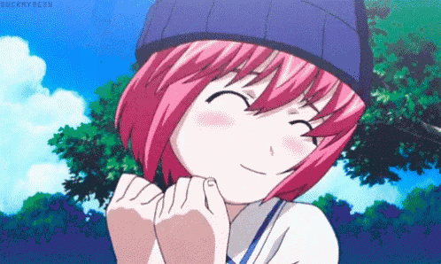 a girl with pink hair wearing a blue hat is smiling .