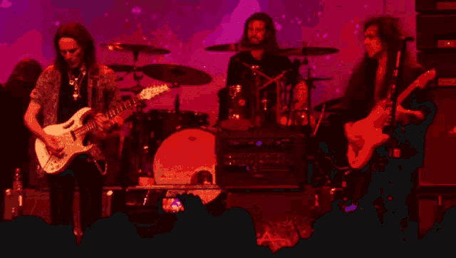 a man with long hair is playing a guitar in front of a purple background