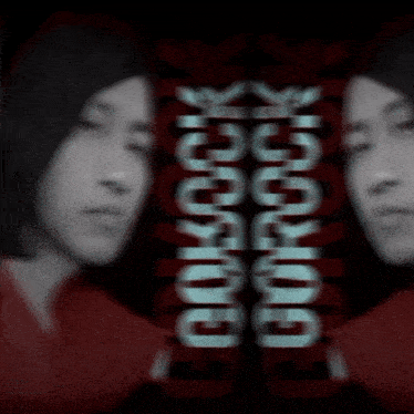 a blurred image of two men with the words gorock written in white