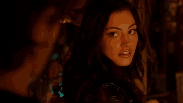 a close up of a woman looking at a man