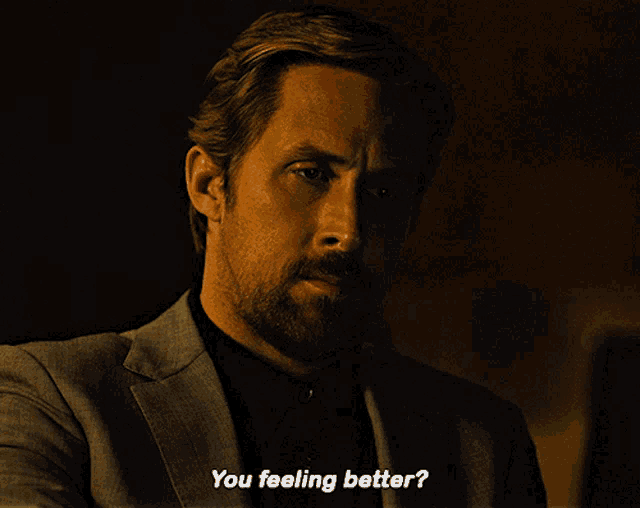 a man in a suit and black shirt says " you feeling better "