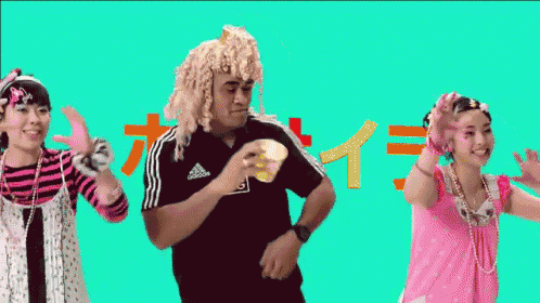 a man in a black shirt that says all blacks is dancing with two women