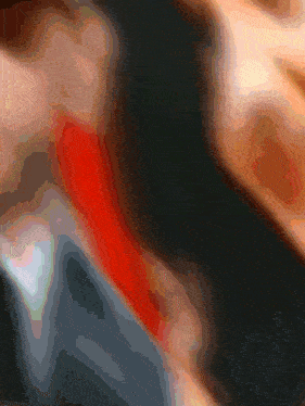 a man in a suit and tie has a red tie