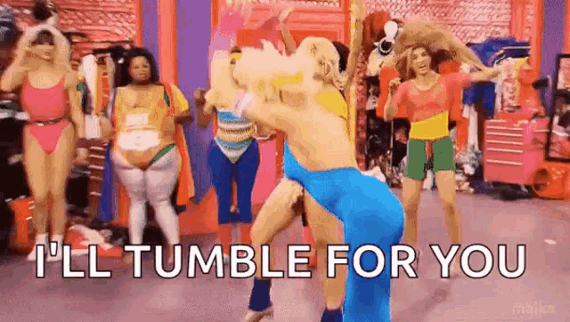 a group of women are dancing in a room with the words `` i 'll tumble for you '' written in the corner .