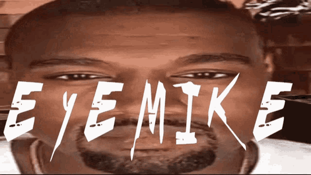 a close up of a man 's face with the name eye mike written on it