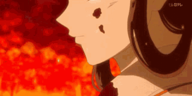 a close up of a person 's face with a red background