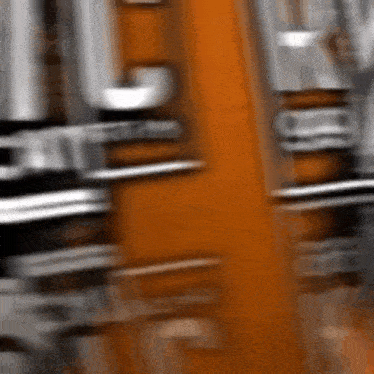 a close up of a blurred image of a drum set with a drummer playing it .