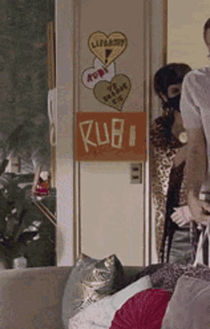 a room with a sign on the door that says rub1