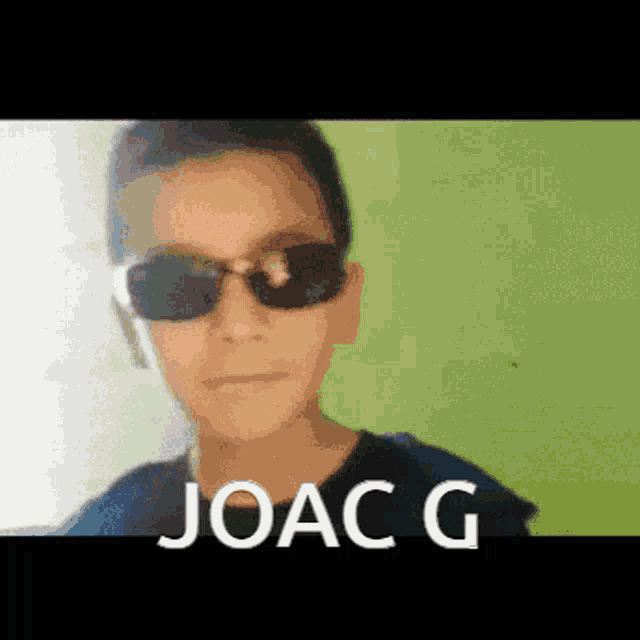 a young boy wearing sunglasses has the name joac g on the bottom